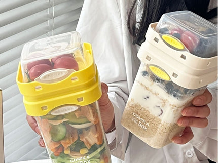 Yellow Portable salad cup with ingredient compartment and fork and spoon - enjoy breakfast on the go