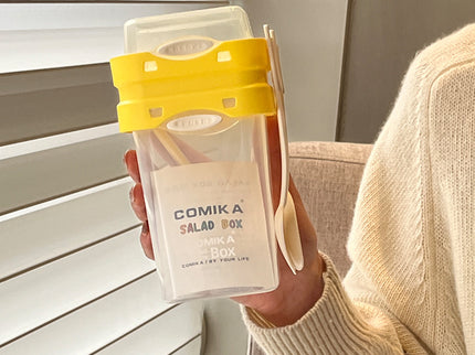 Yellow Portable salad cup with ingredient compartment and fork and spoon - enjoy breakfast on the go